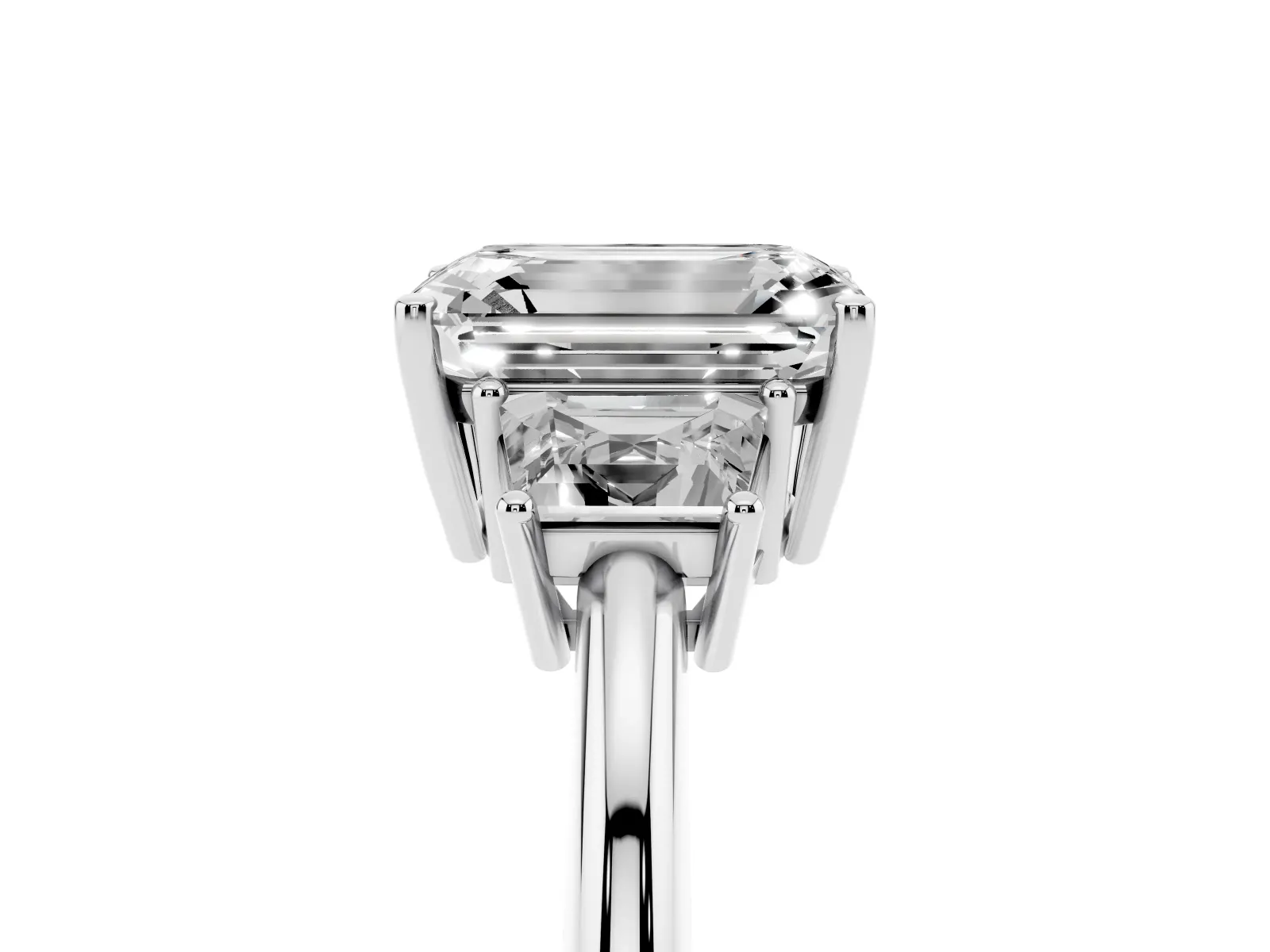 Emerald Cut Diamond Three-Stone Ring with Trapezoid Side Stones and Prong Setting Platinum