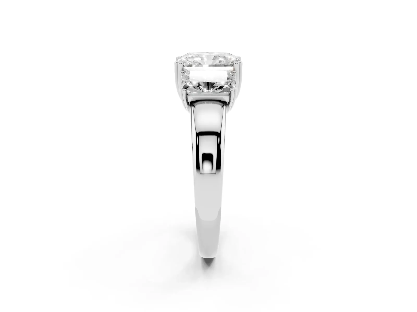 Three-Stone Radiant Cut Cut Diamond Ring with Channel Set Band and Four-Prong Setting White gold