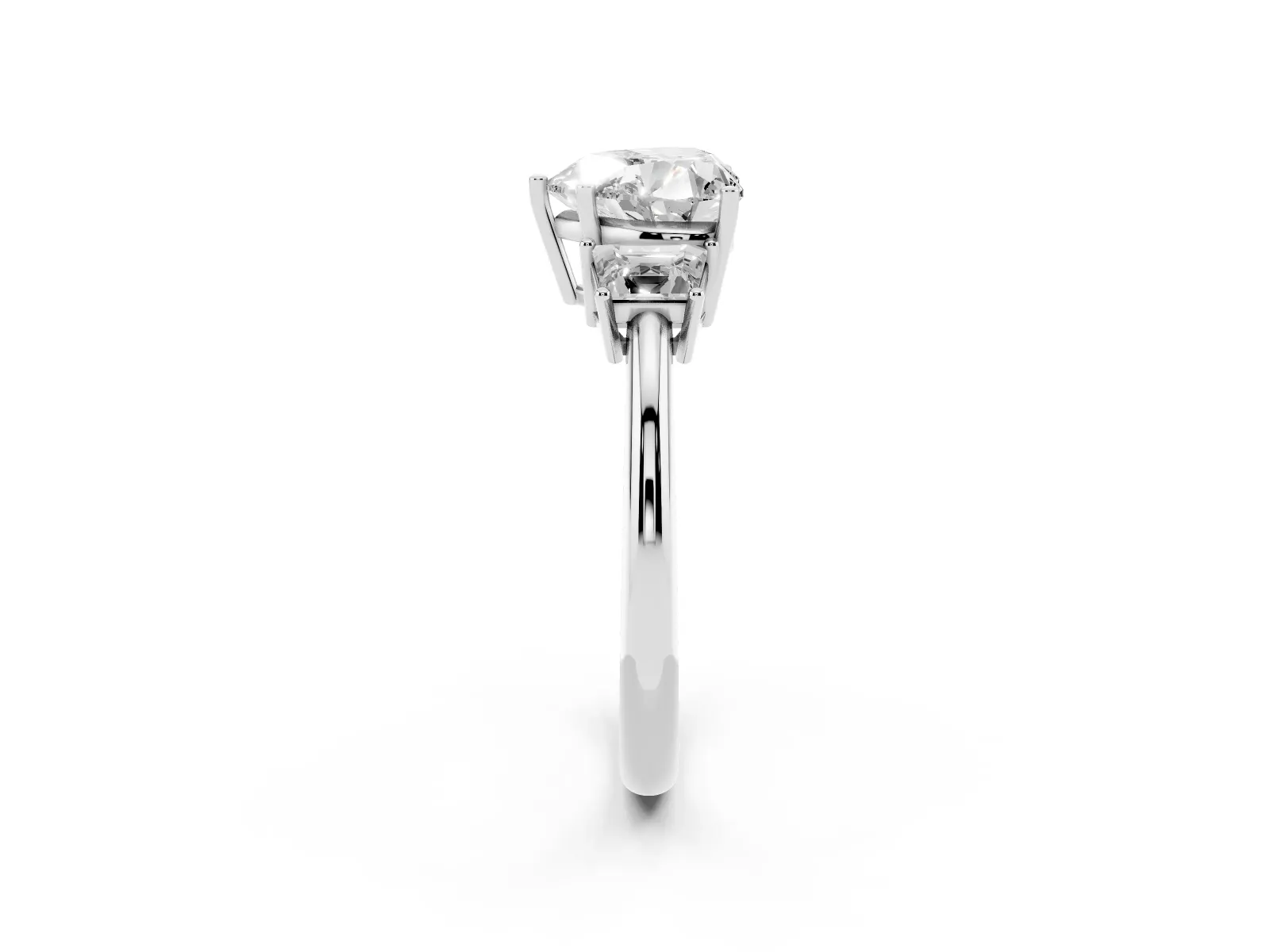 Heart Cut Diamond Three-Stone Ring with Trapezoid Side Stones and Prong Setting White gold