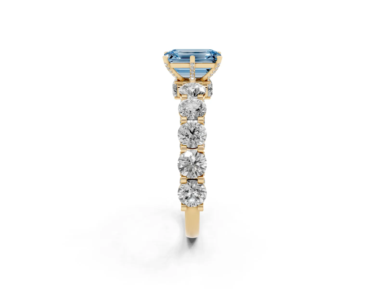 Fancy Blue Emerald Cut Diamond Side Stone Engagement Ring with Four-Prong Setting Yellow gold
