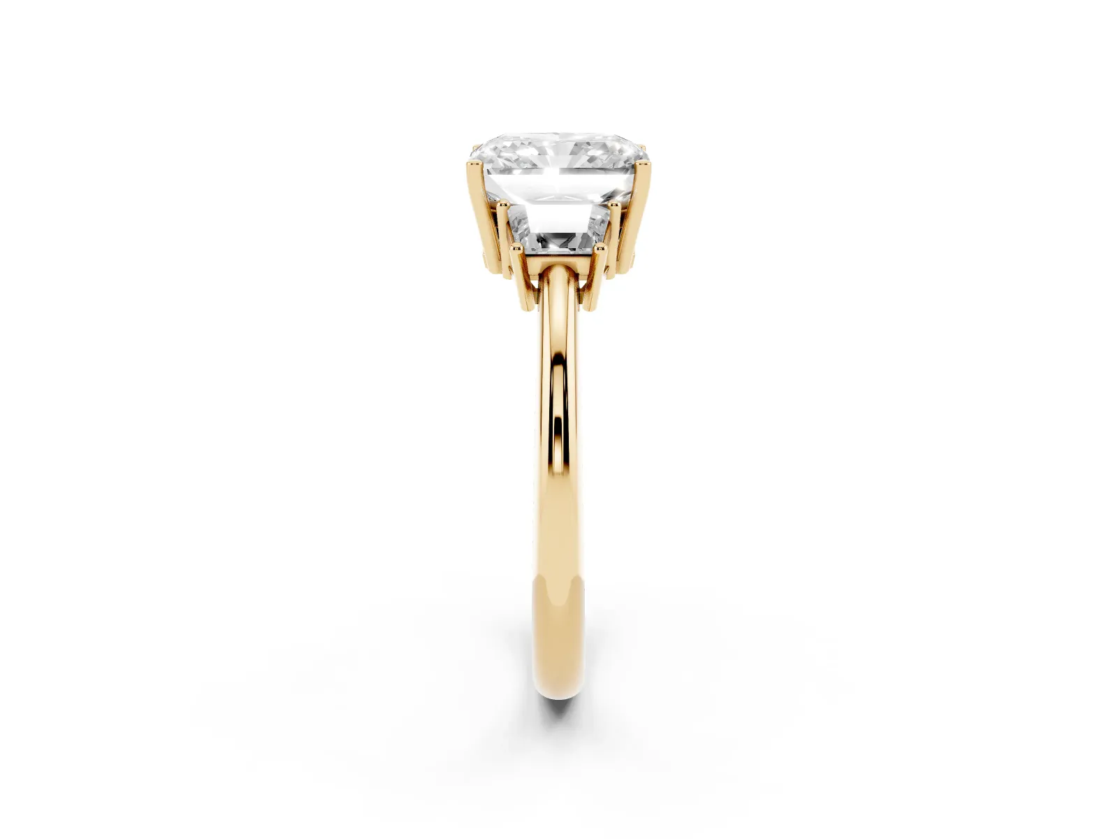 Radiant Cut Diamond Three-Stone Ring with Trapezoid Side Stones and Prong Setting Yellow gold