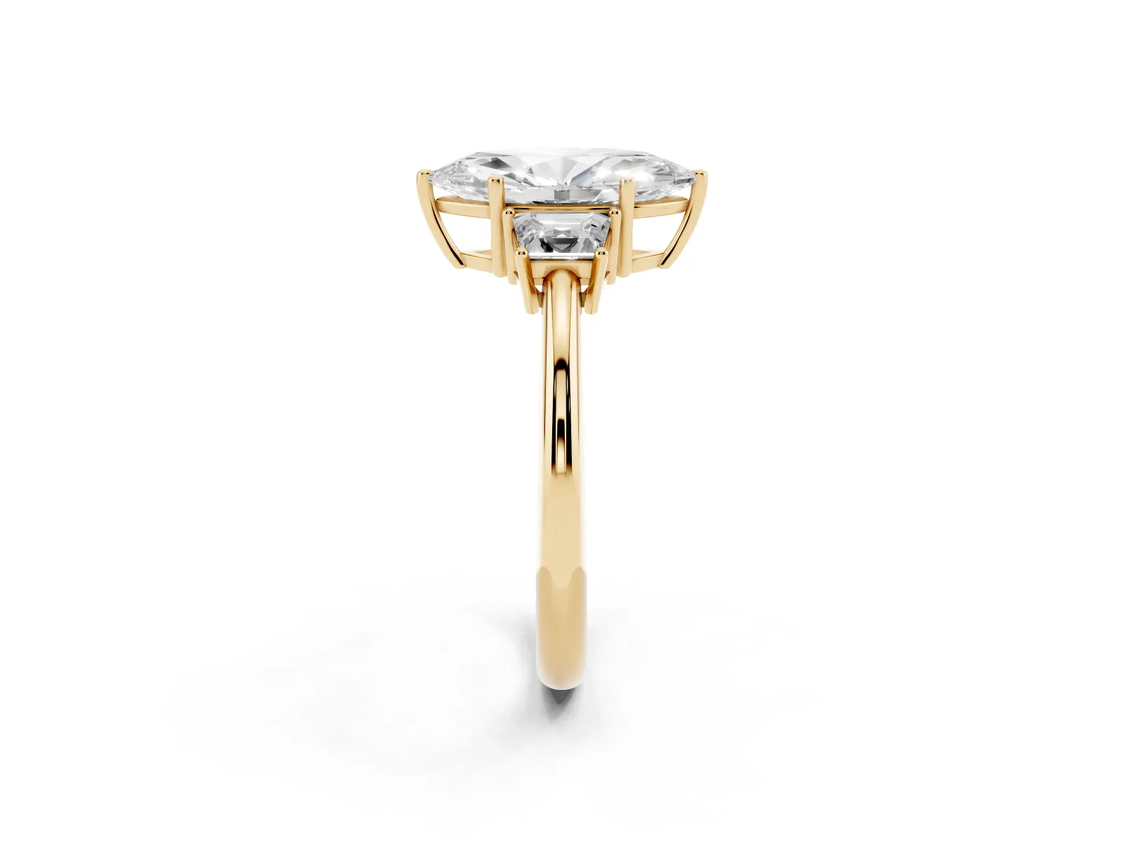 Marquise Cut Diamond Three-Stone Ring with Trapezoid Side Stones and Prong Setting Yellow gold
