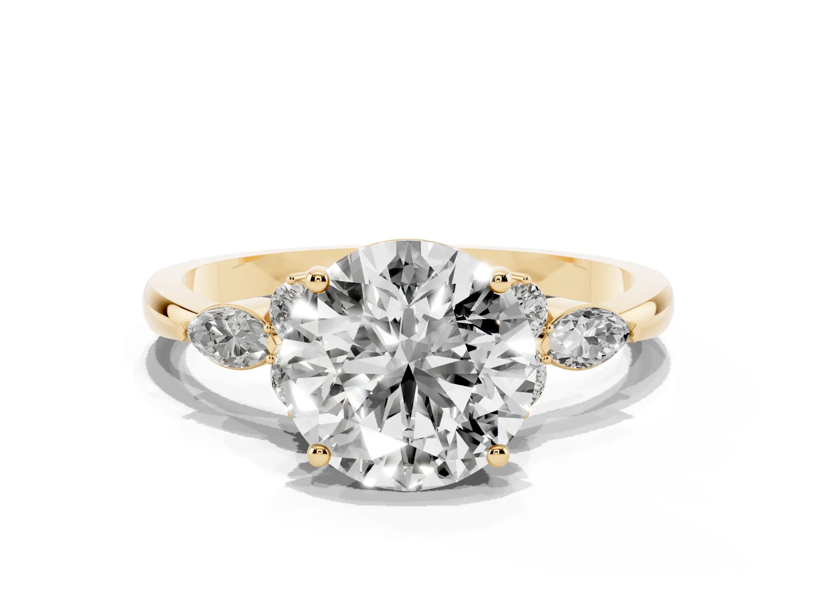 Round Cut Brilliant Diamond Solitaire Ring with Pear Side Stones and Four-Prong Setting Yellow gold