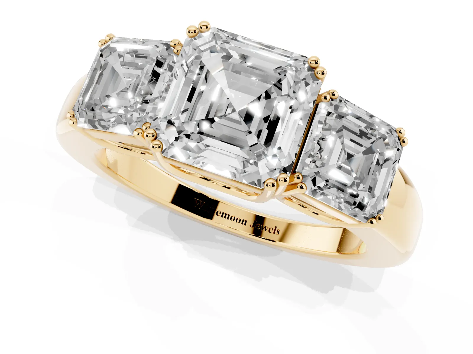 Three-Stone Asscher Cut Cut Diamond Ring with Channel Set Band and Four-Prong Setting Yellow gold