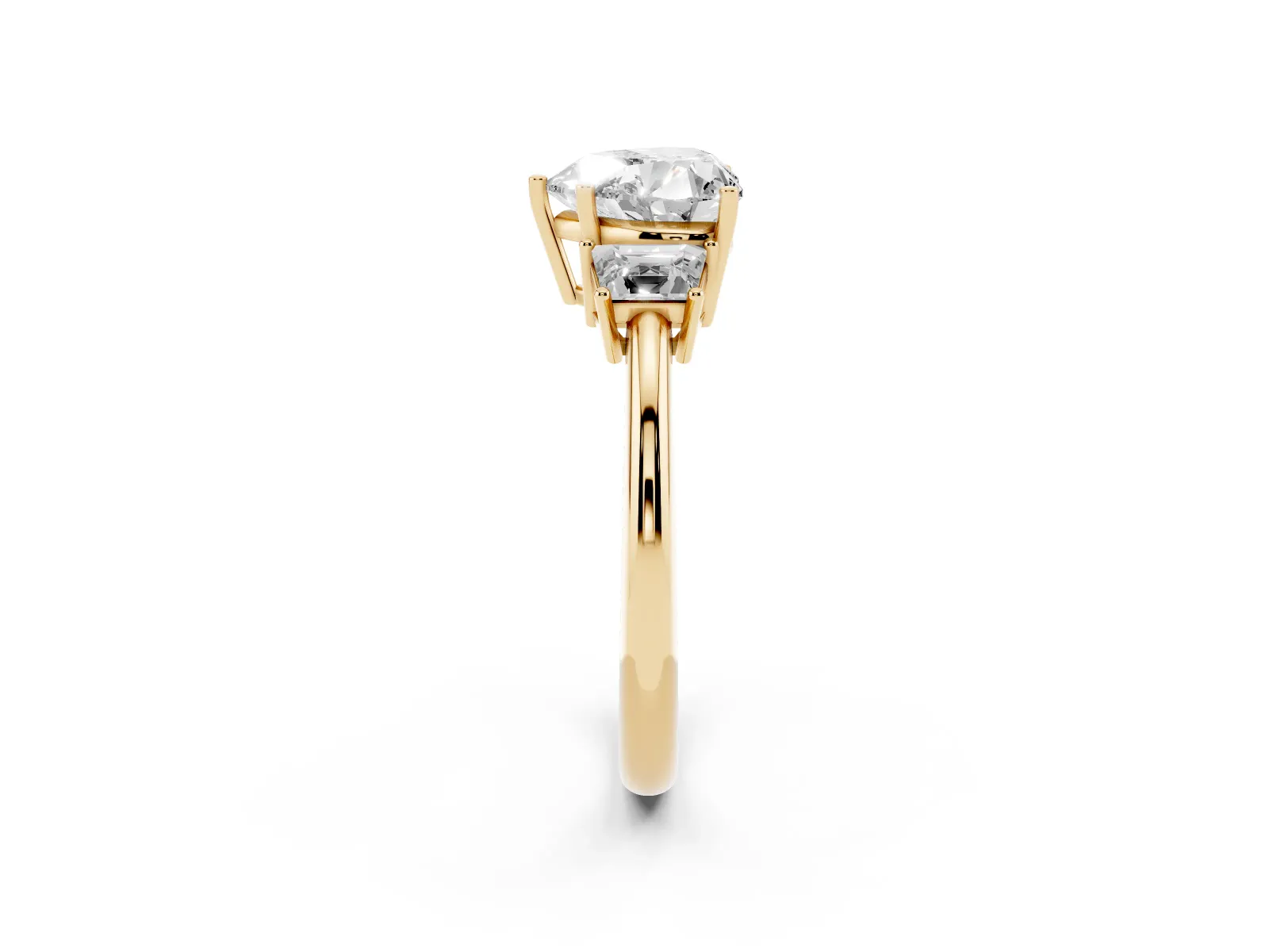 Heart Cut Diamond Three-Stone Ring with Trapezoid Side Stones and Prong Setting Yellow gold
