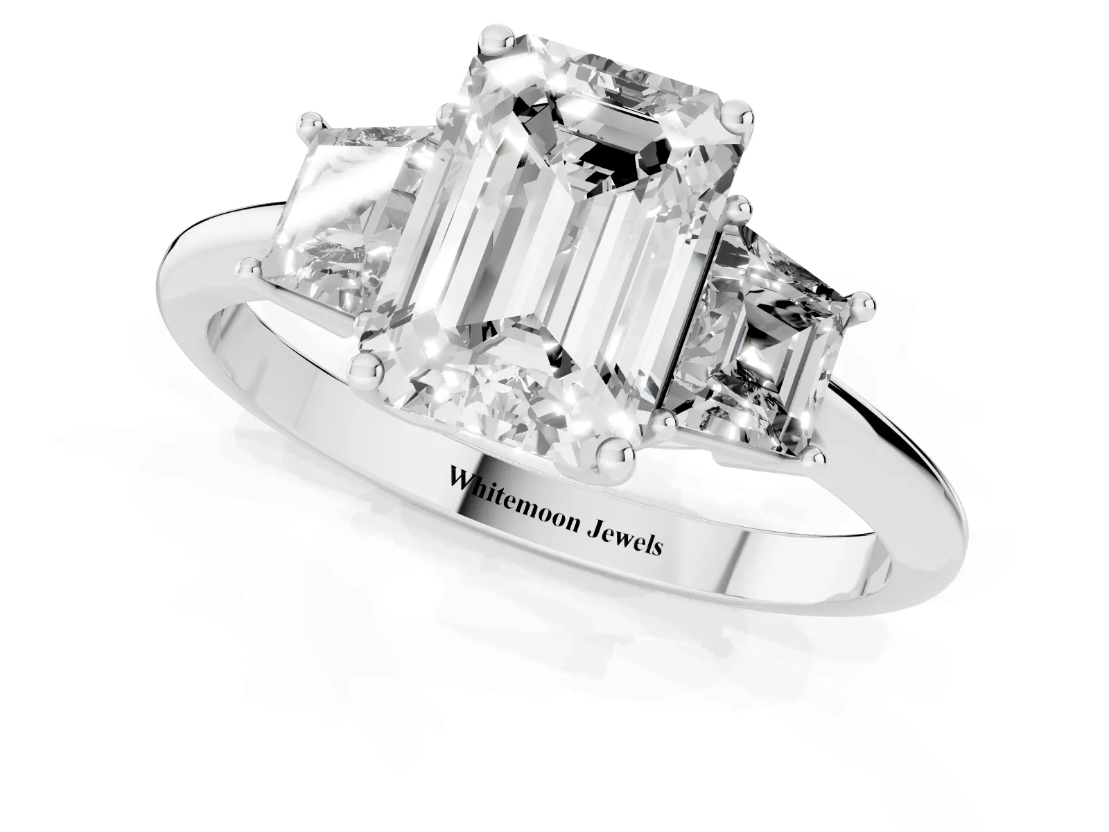 Emerald Cut Diamond Three-Stone Ring with Trapezoid Side Stones and Prong Setting Platinum