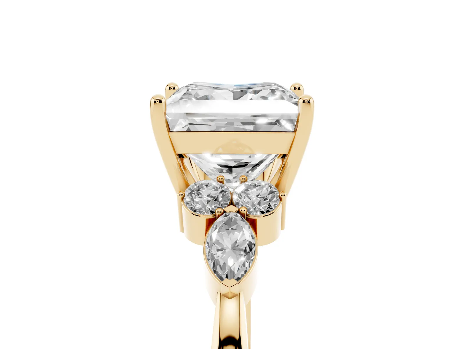 Princess Cut Brilliant Diamond Solitaire Ring with Pear Side Stones and Four-Prong Setting Yellow gold