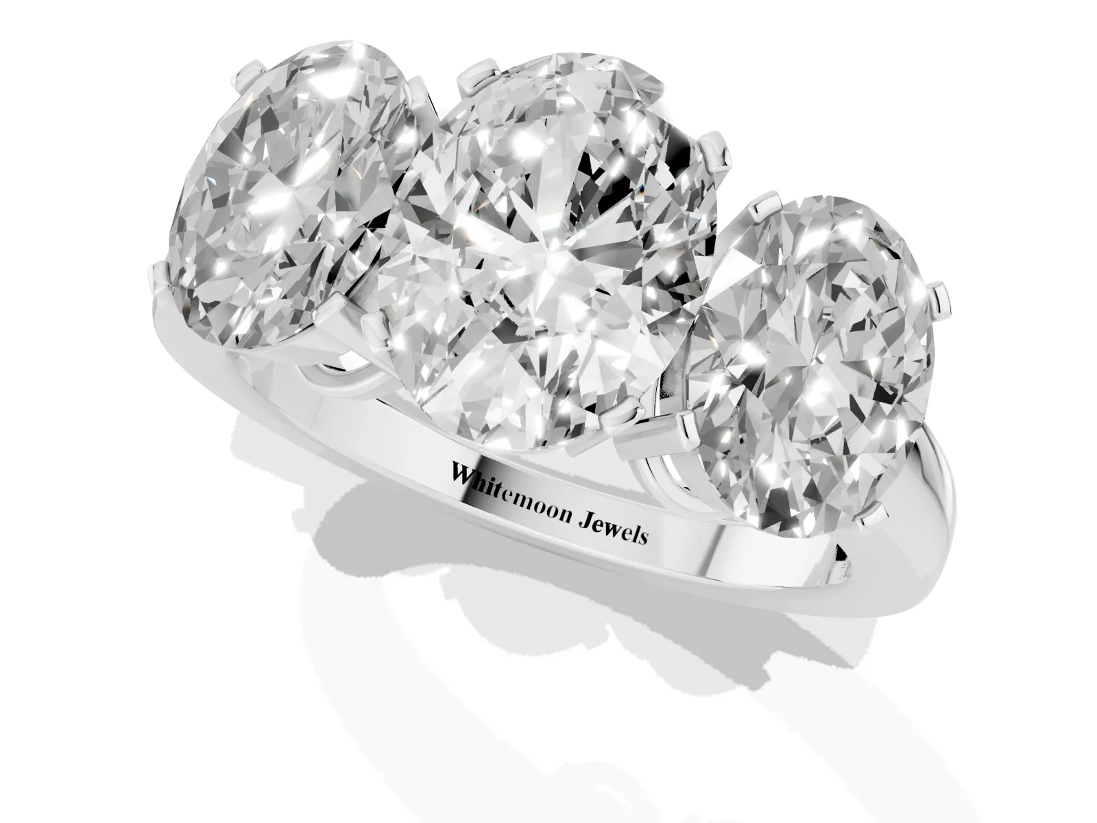Three-Stone Oval Cut Cut Diamond Ring with Channel Set Band and Four-Prong Setting Platinum