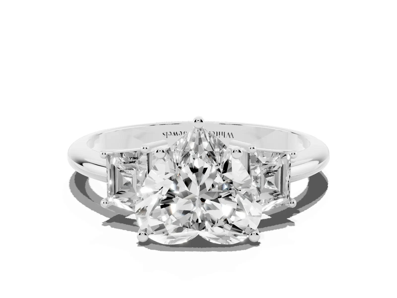 Heart Cut Diamond Three-Stone Ring with Trapezoid Side Stones and Prong Setting White gold