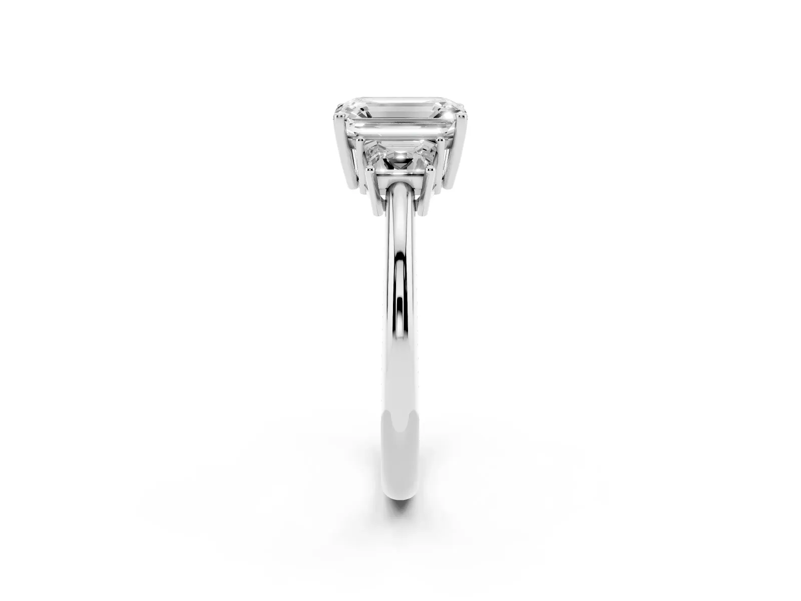 Emerald Cut Diamond Three-Stone Ring with Trapezoid Side Stones and Prong Setting Platinum