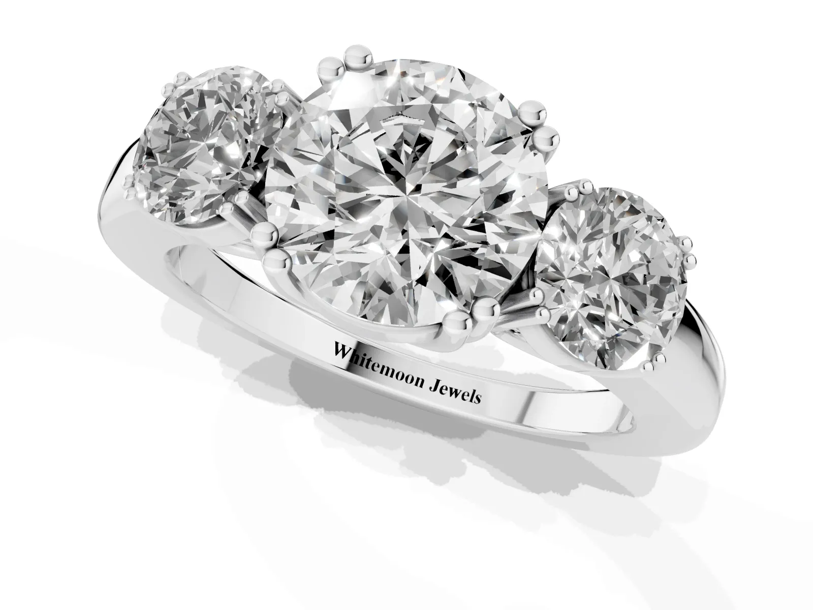 Three-Stone Round Cut Cut Diamond Ring with Channel Set Band and Four-Prong Setting White gold