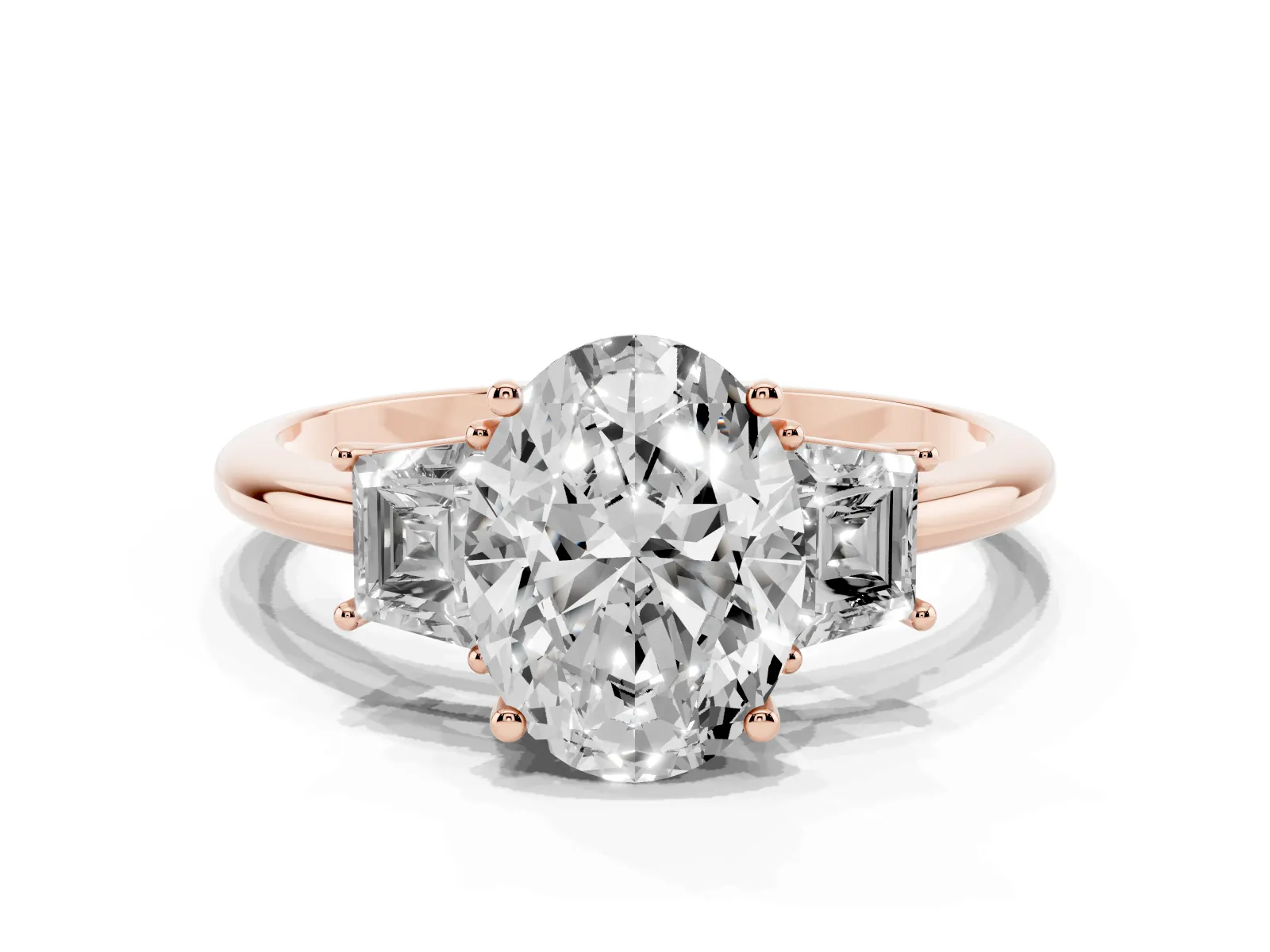 Oval Cut Diamond Three-Stone Ring with Trapezoid Side Stones and Prong Setting Rose gold