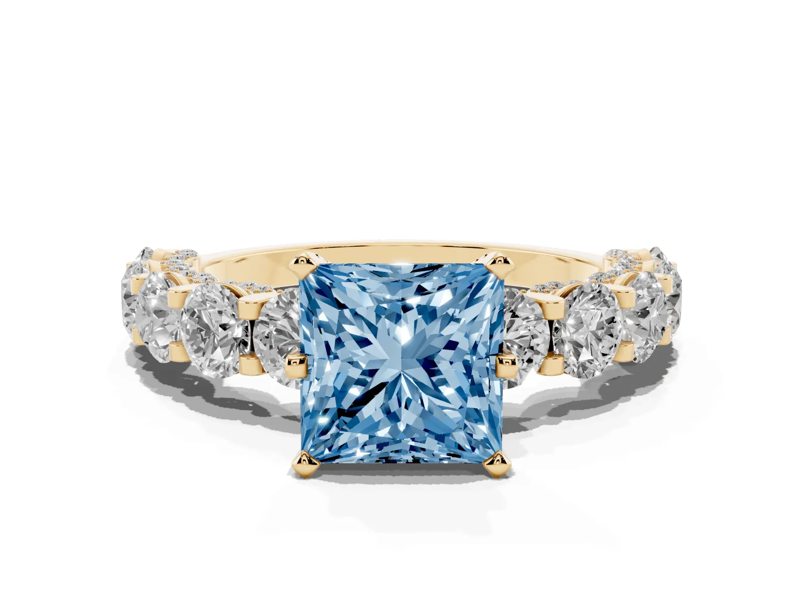 Fancy Blue Princess Cut Diamond Side Stone Engagement Ring with Four-Prong Setting Yellow gold