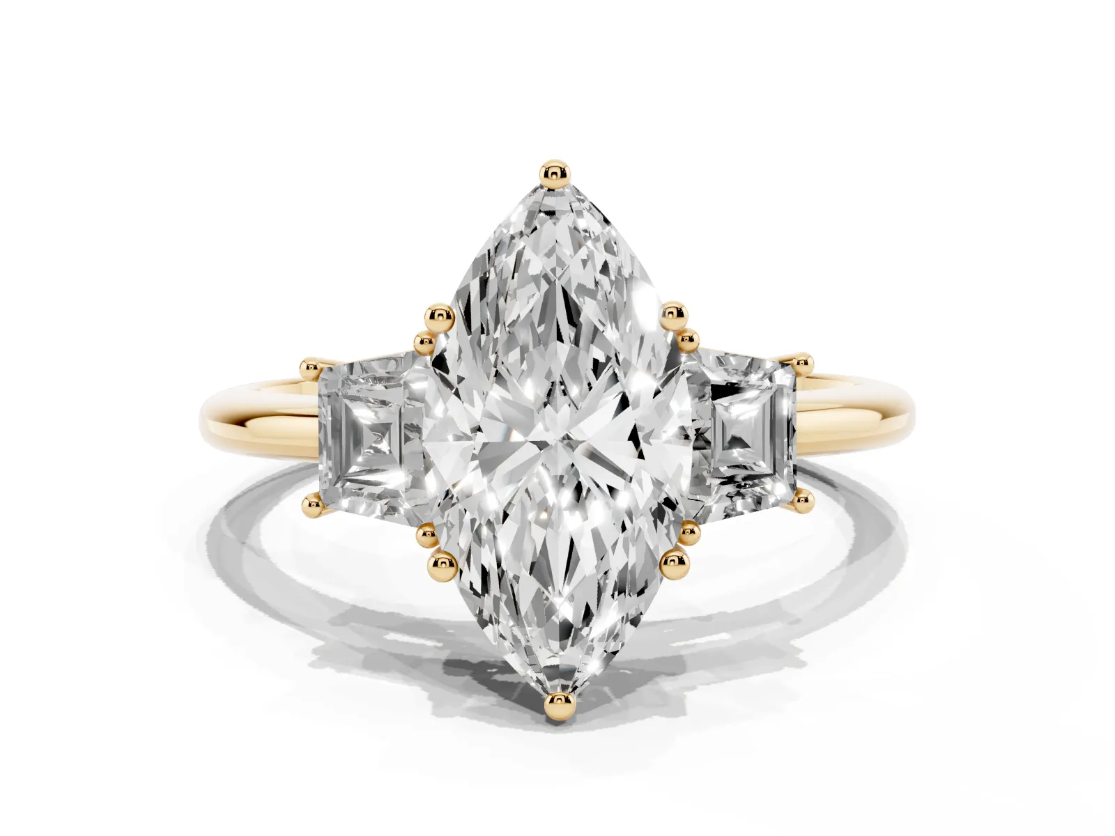 Marquise Cut Diamond Three-Stone Ring with Trapezoid Side Stones and Prong Setting Yellow gold