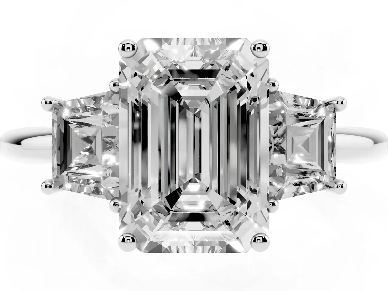 Emerald Cut Diamond Three-Stone Ring with Trapezoid Side Stones and Prong Setting Platinum