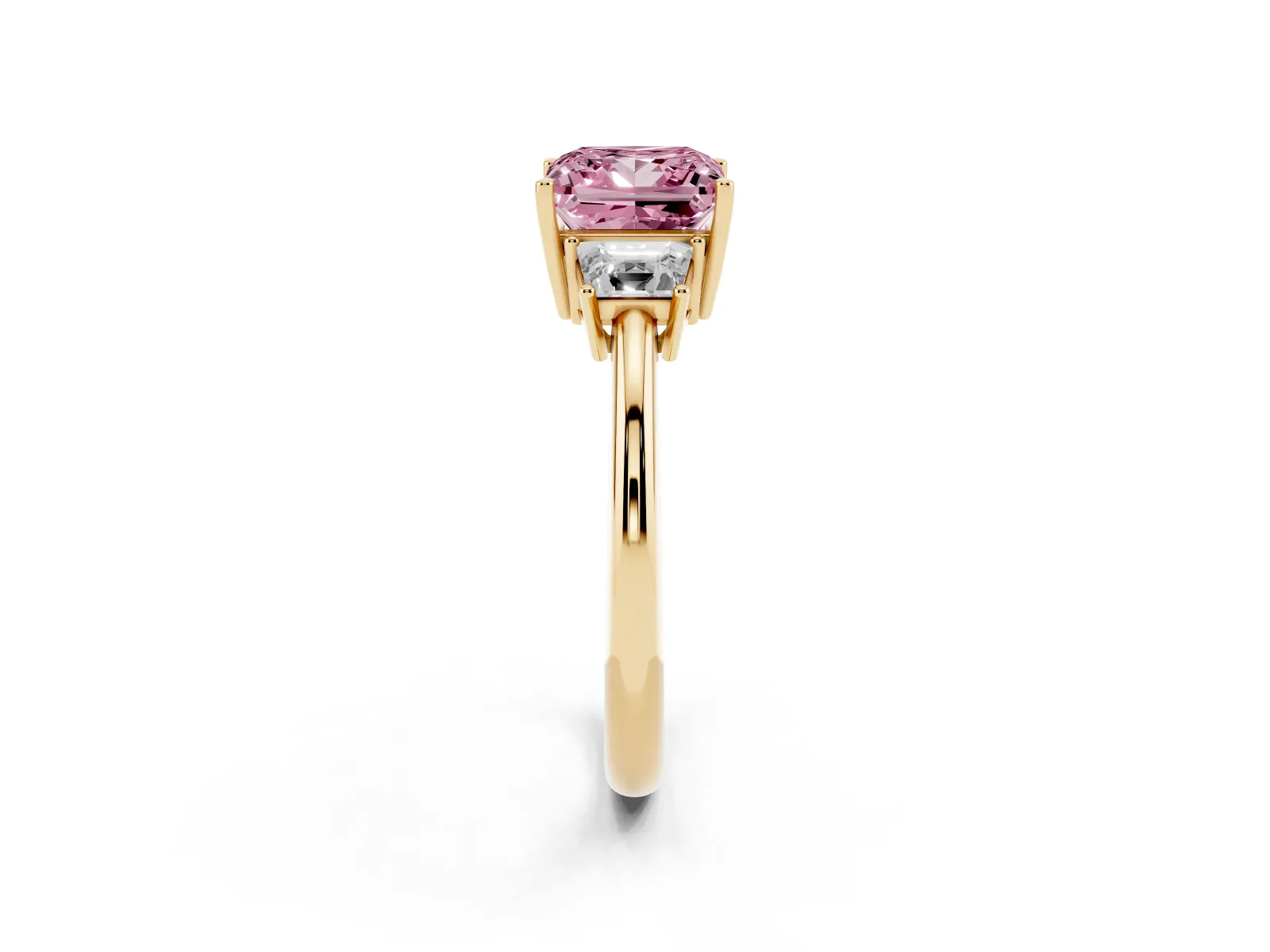 Fancy Pink Princess Cut Diamond Three-Stone Ring with Trapezoid Side Stones and Prong Setting Yellow gold