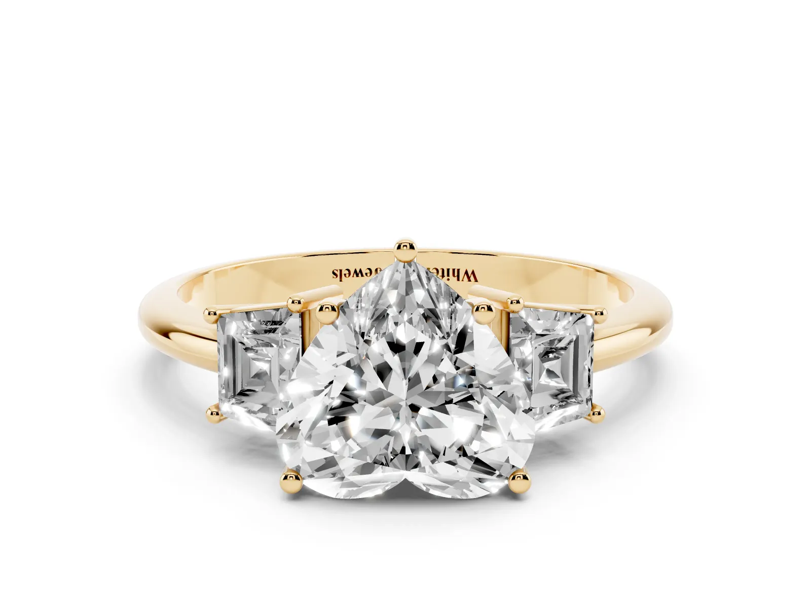 Heart Cut Diamond Three-Stone Ring with Trapezoid Side Stones and Prong Setting Yellow gold