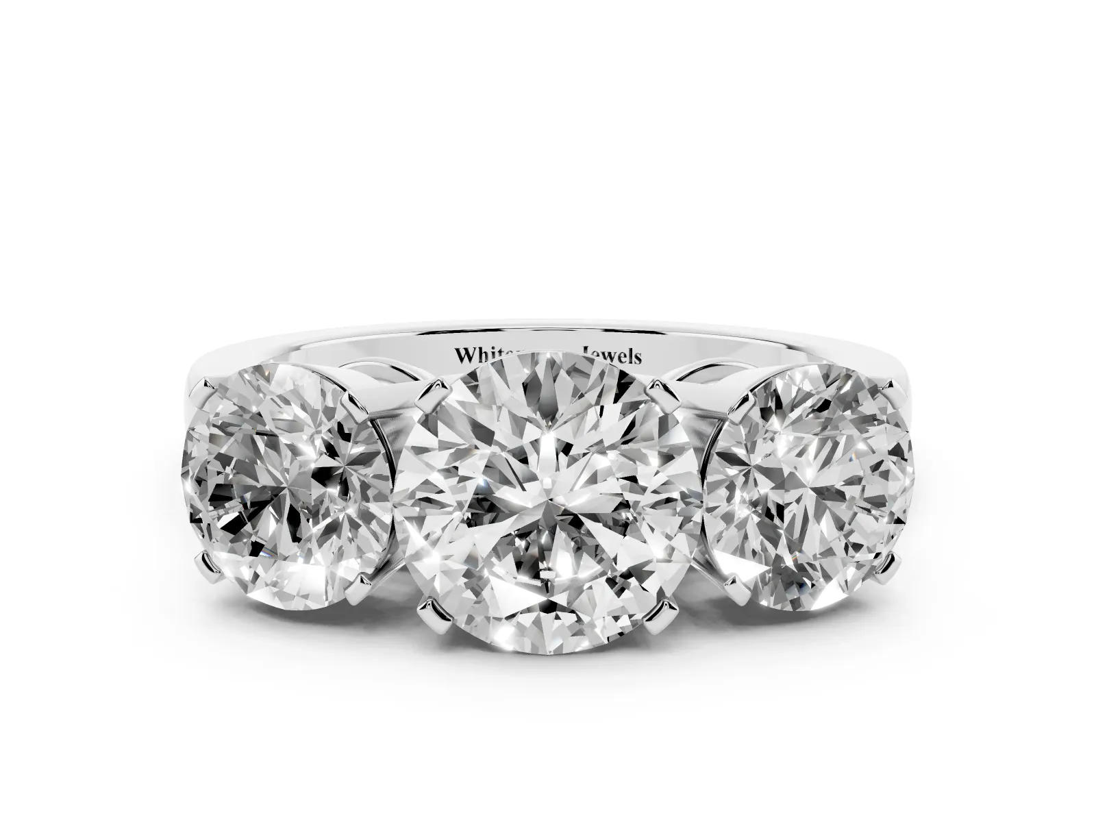 Three-Stone Round Cut Cut Diamond Ring with Channel Set Band and Four-Prong Setting Platinum
