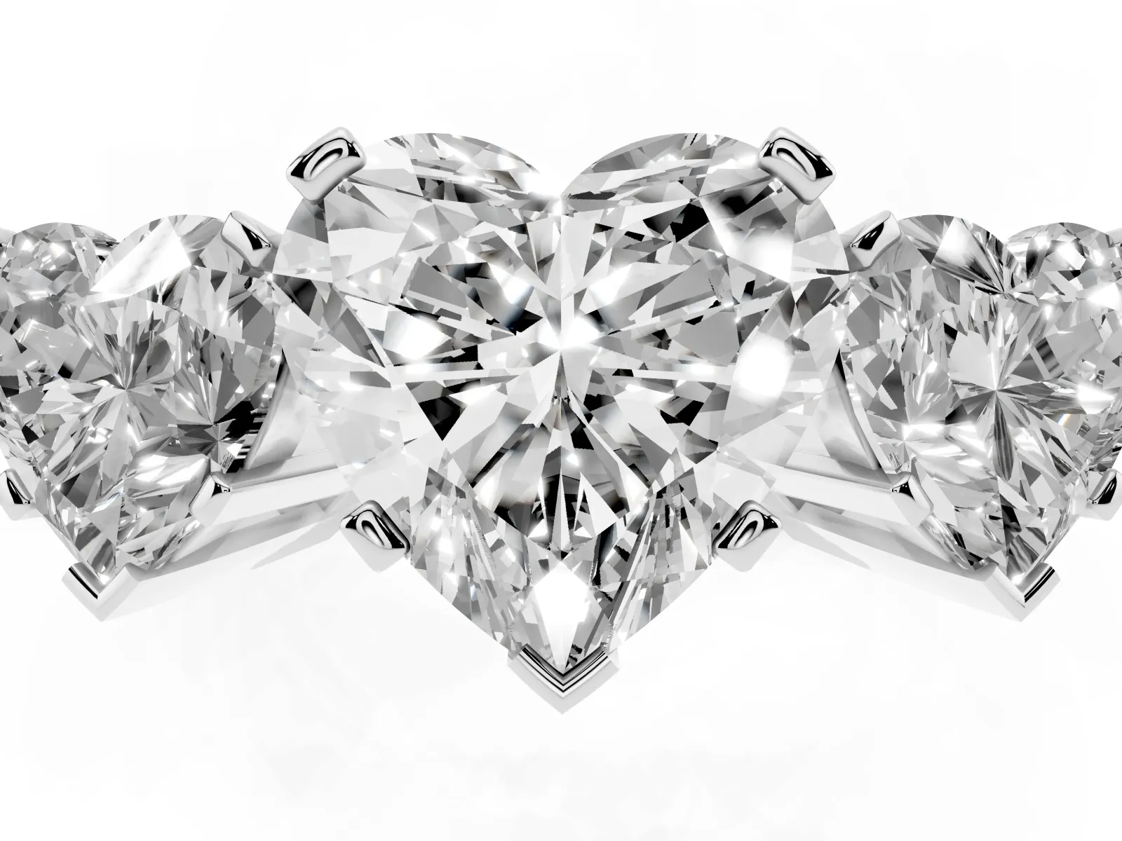 Three-Stone Heart Cut Cut Diamond Ring with Channel Set Band and Four-Prong Setting Platinum