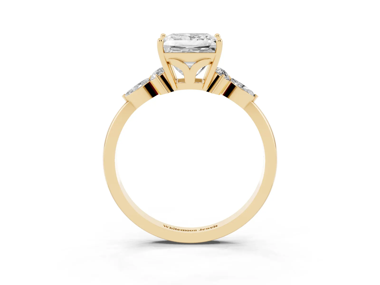 Princess Cut Brilliant Diamond Solitaire Ring with Pear Side Stones and Four-Prong Setting Yellow gold