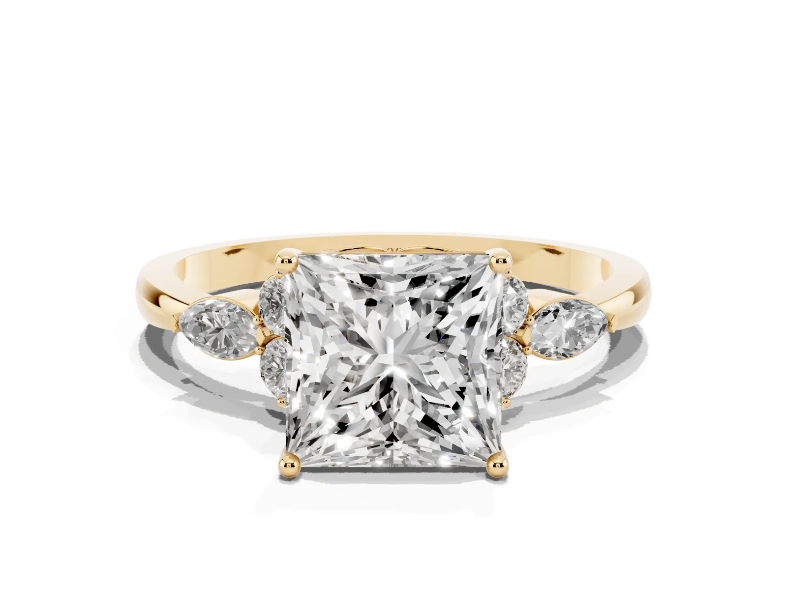 Princess Cut Brilliant Diamond Solitaire Ring with Pear Side Stones and Four-Prong Setting Yellow gold