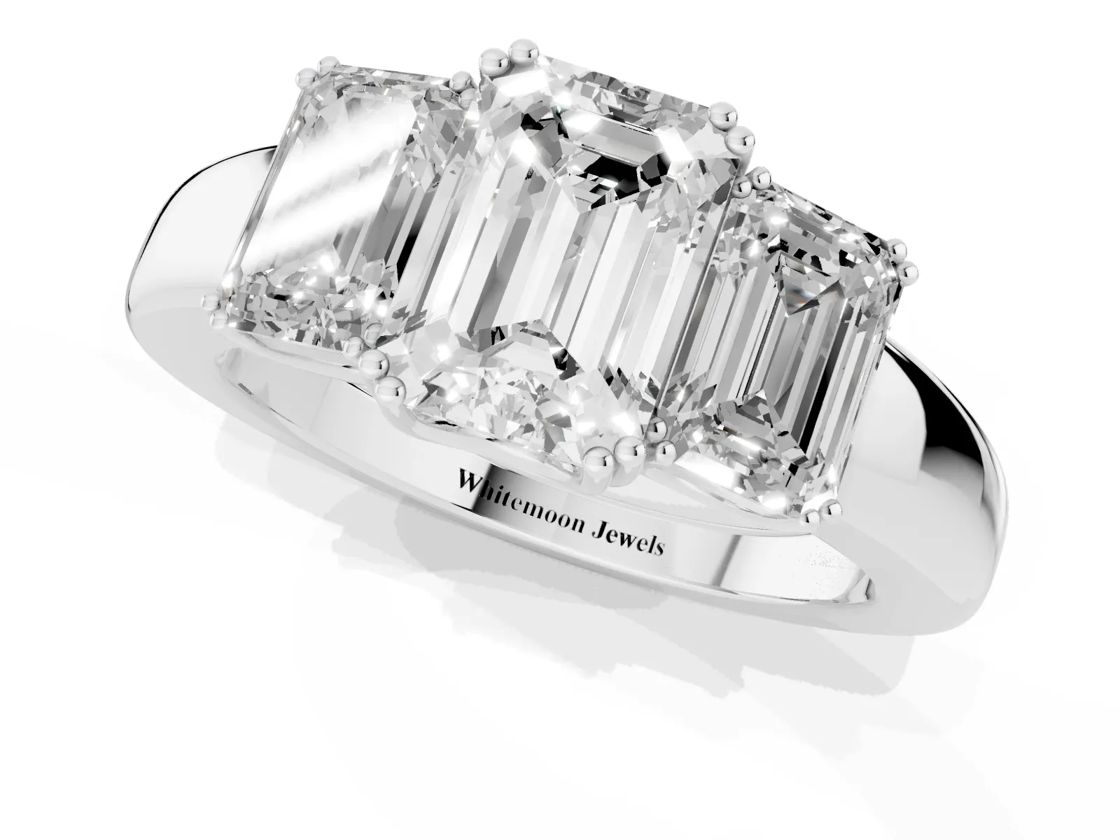 Three-Stone Emerald Cut Cut Diamond Ring with Channel Set Band and Four-Prong Setting White gold