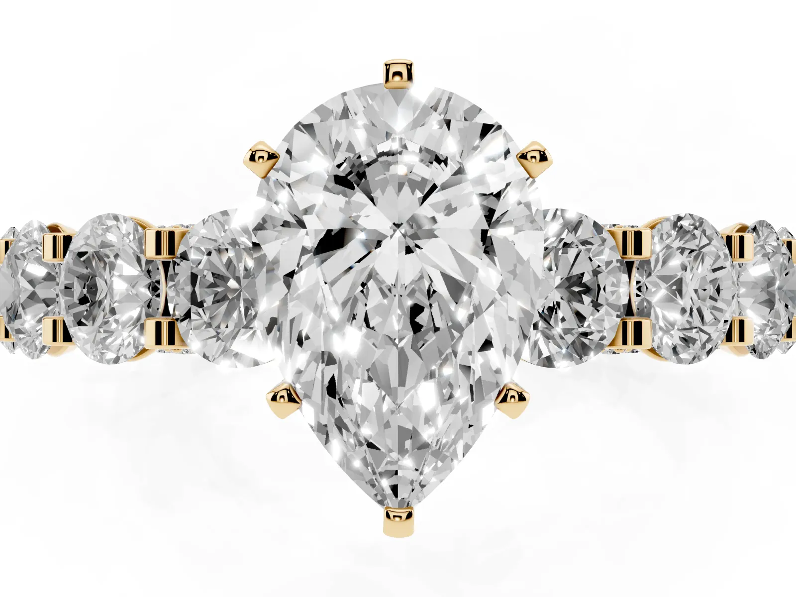 Pear Cut Diamond Side Stone Engagement Ring with Four-Prong Setting Yellow gold