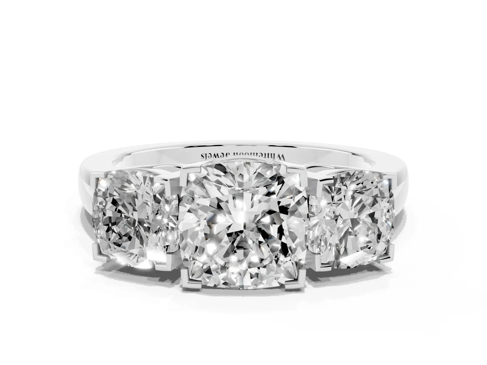 Three-Stone Cushion Cut Cut Diamond Ring with Channel Set Band and Four-Prong Setting Platinum