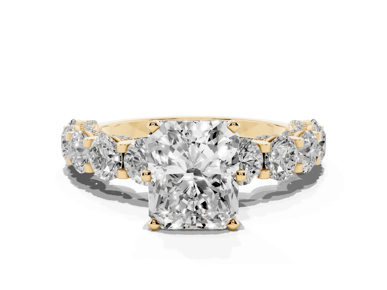 Radiant Cut Diamond Side Stone Engagement Ring with Four-Prong Setting Yellow gold