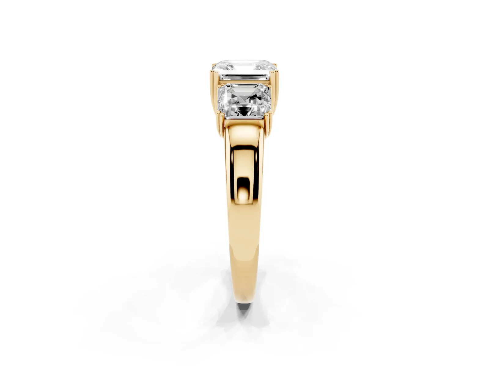 Three-Stone Asscher Cut Cut Diamond Ring with Channel Set Band and Four-Prong Setting Yellow gold
