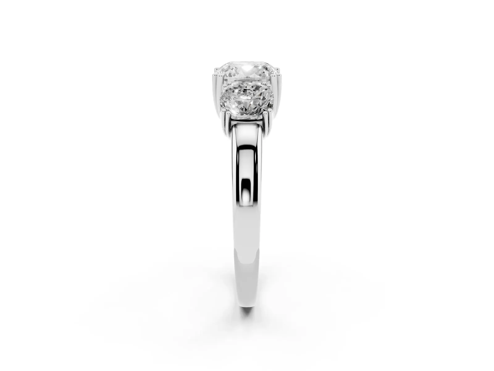 Three-Stone Cushion Cut Cut Diamond Ring with Channel Set Band and Four-Prong Setting White gold