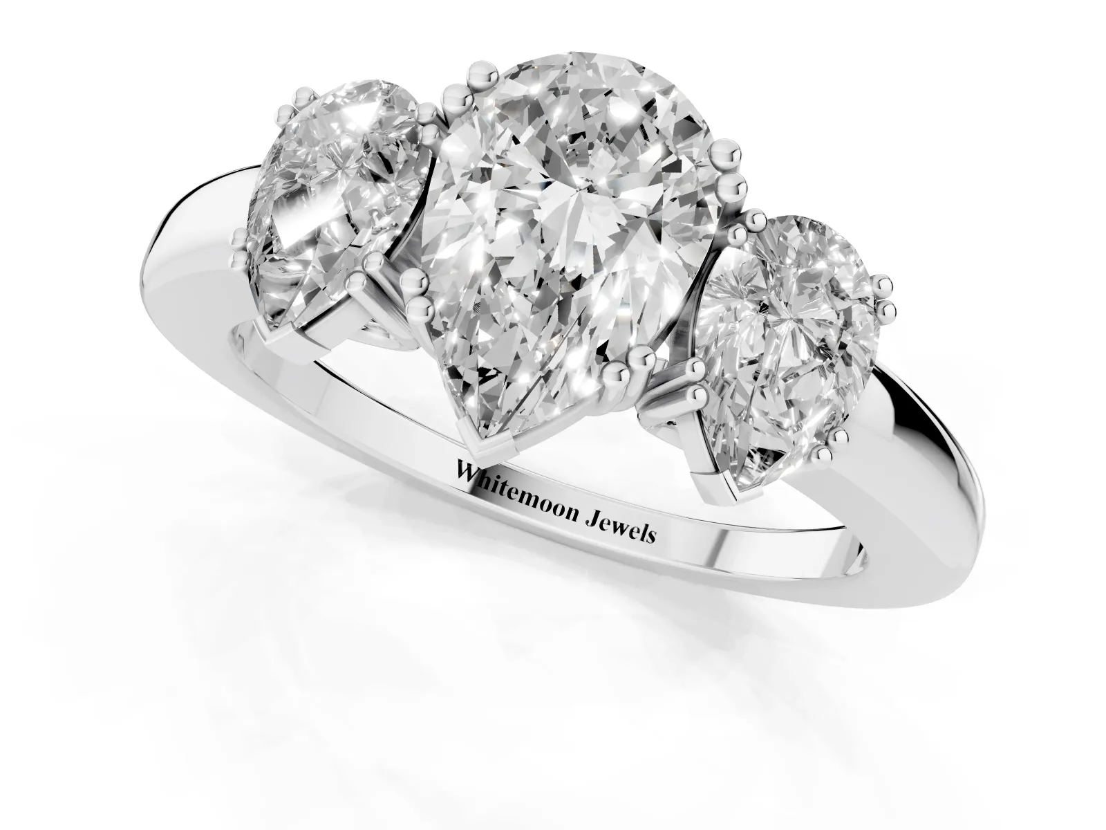 Three-Stone Pear Cut Cut Diamond Ring with Channel Set Band and Four-Prong Setting White gold