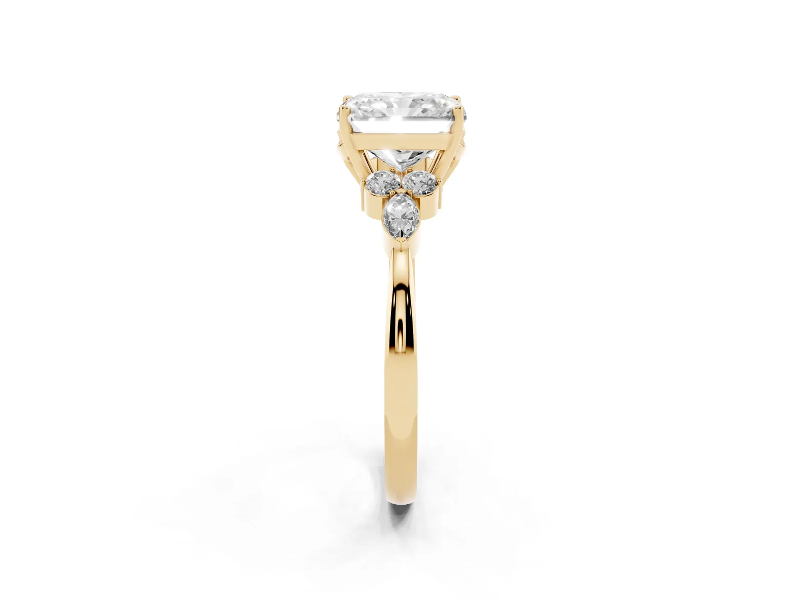 Radiant Cut Brilliant Diamond Solitaire Ring with Pear Side Stones and Four-Prong Setting Yellow gold