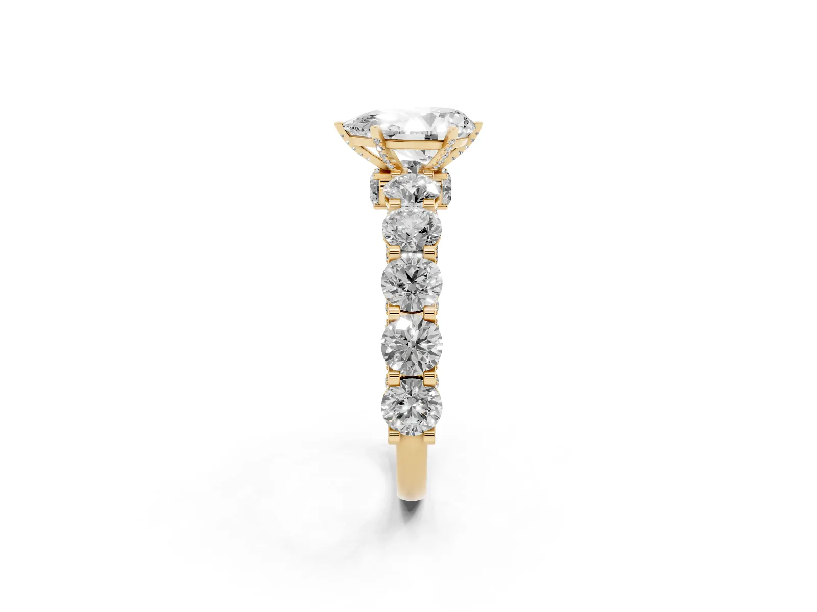Pear Cut Diamond Side Stone Engagement Ring with Four-Prong Setting Yellow gold
