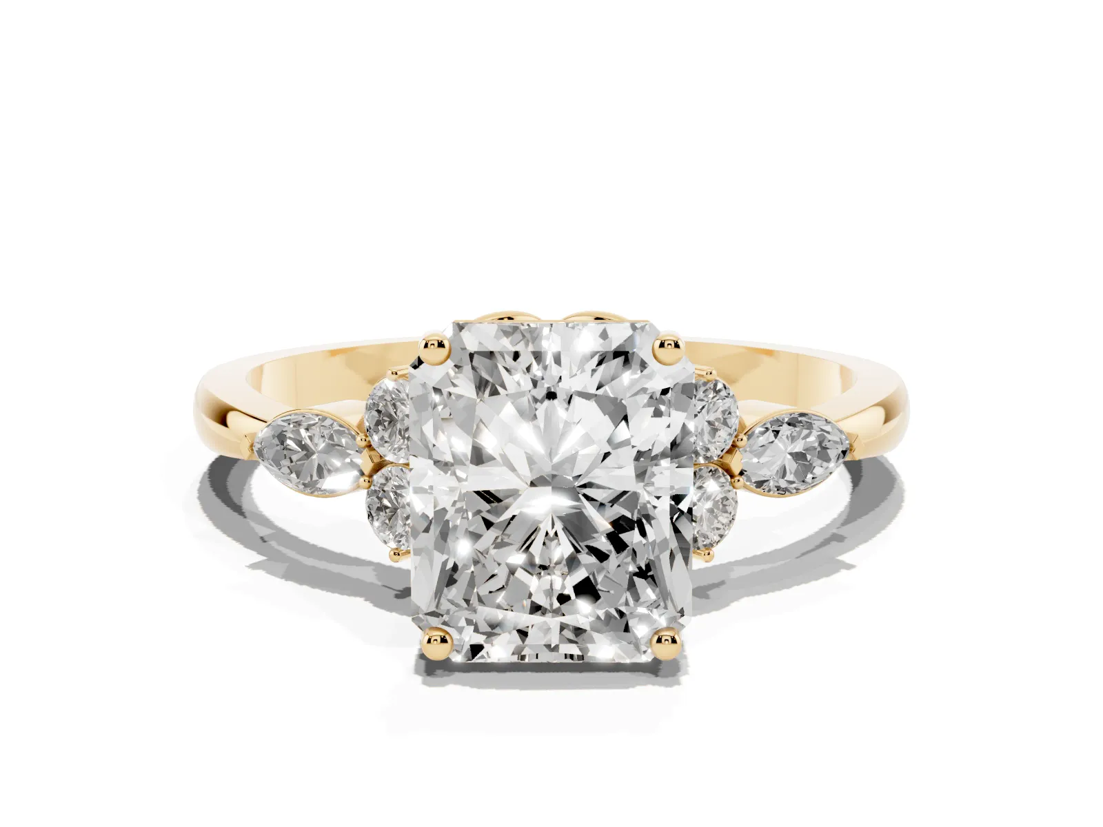 Radiant Cut Brilliant Diamond Solitaire Ring with Pear Side Stones and Four-Prong Setting Yellow gold
