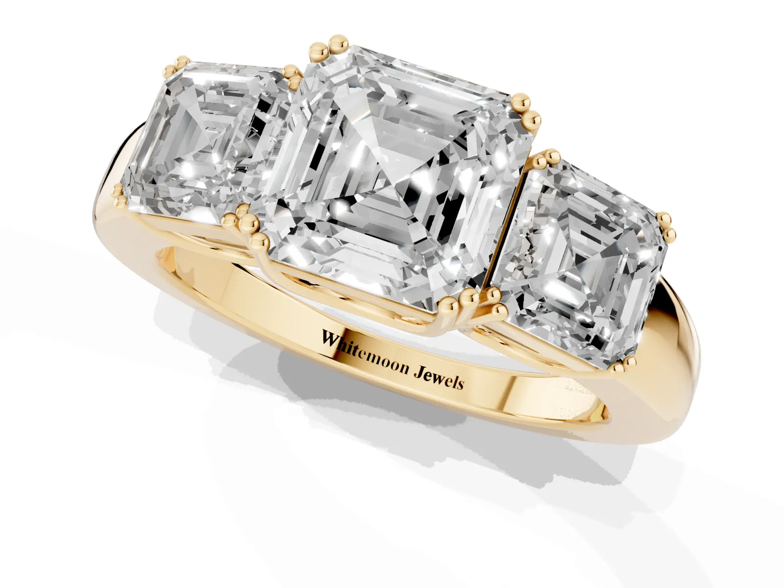 Three-Stone Asscher Cut Cut Diamond Ring with Channel Set Band and Four-Prong Setting Yellow gold