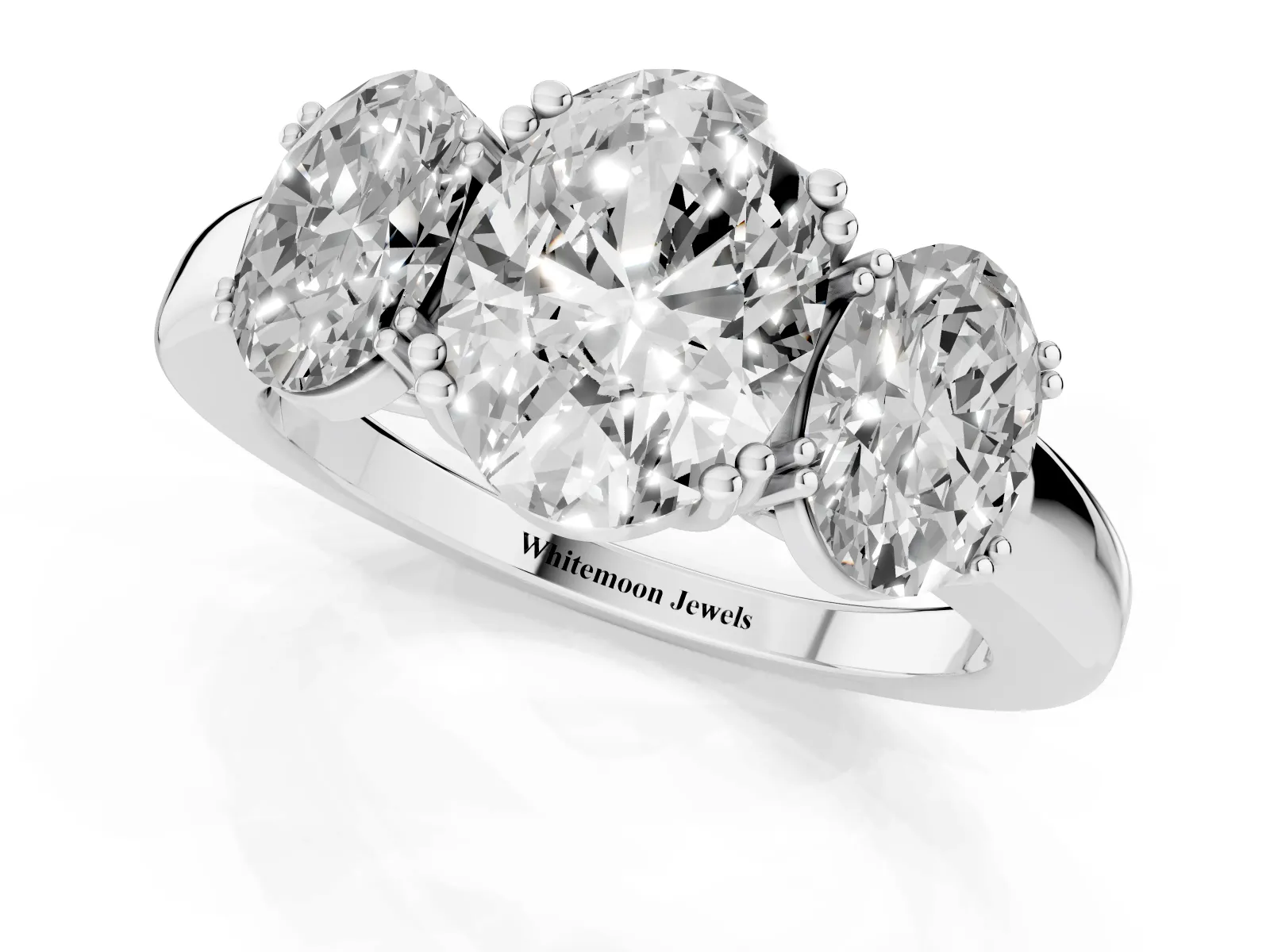 Three-Stone Oval Cut Cut Diamond Ring with Channel Set Band and Four-Prong Setting White gold