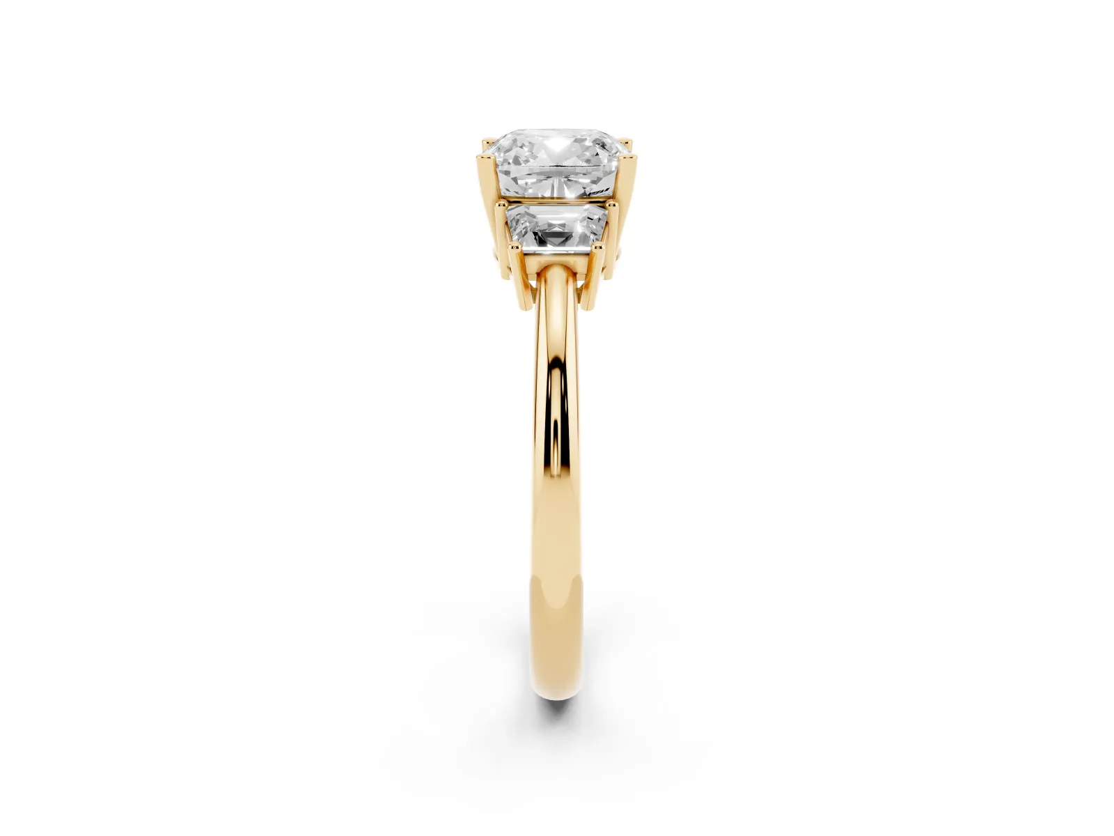 Cushion Cut Diamond Three-Stone Ring with Trapezoid Side Stones and Prong Setting Yellow gold