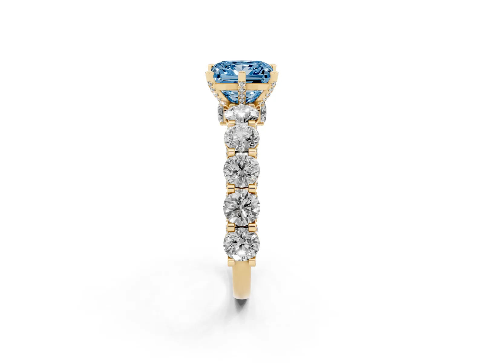 Fancy Blue Princess Cut Diamond Side Stone Engagement Ring with Four-Prong Setting Yellow gold
