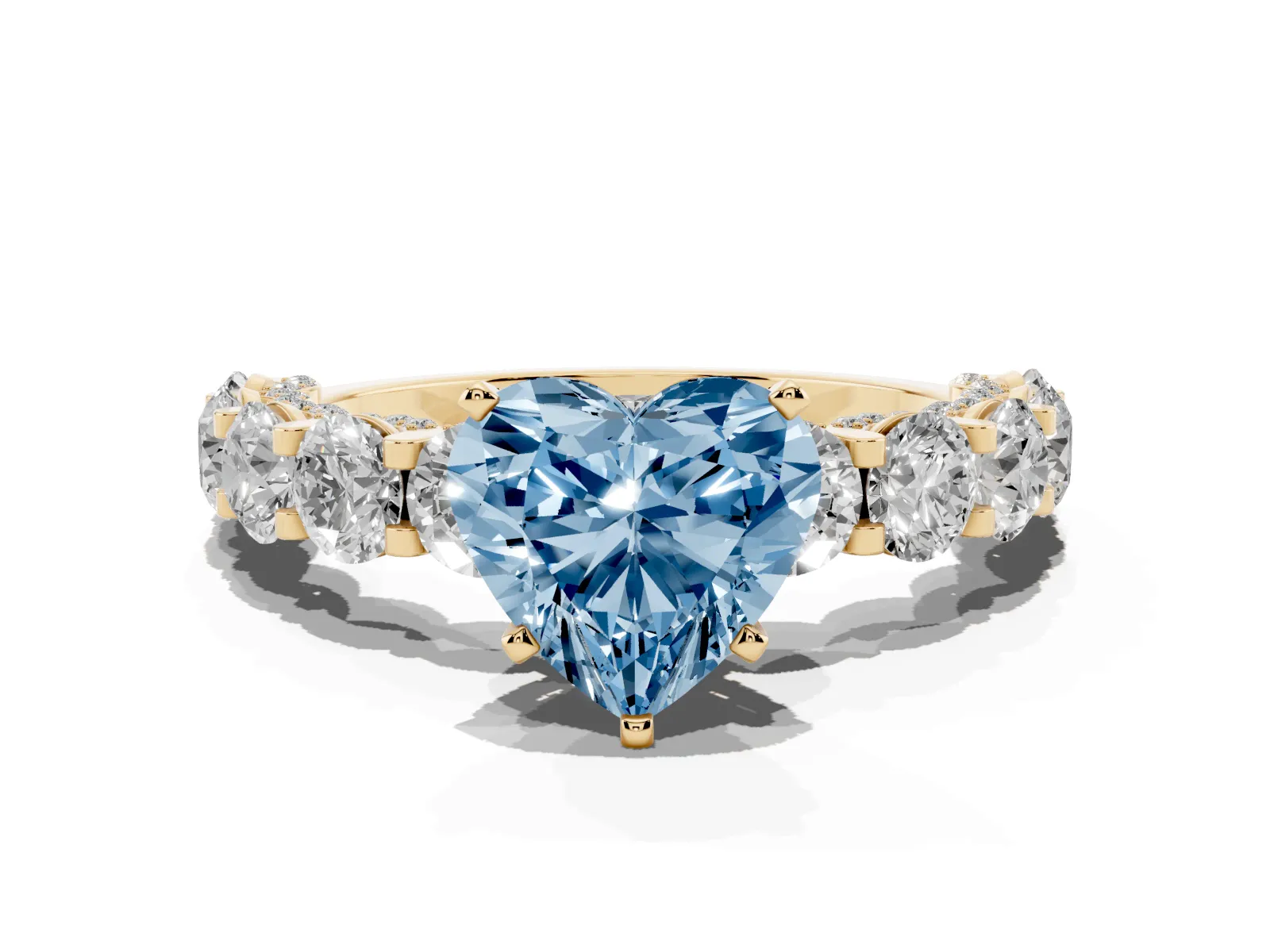 Fancy Blue Heart Cut Diamond Side Stone Engagement Ring with Four-Prong Setting Yellow gold