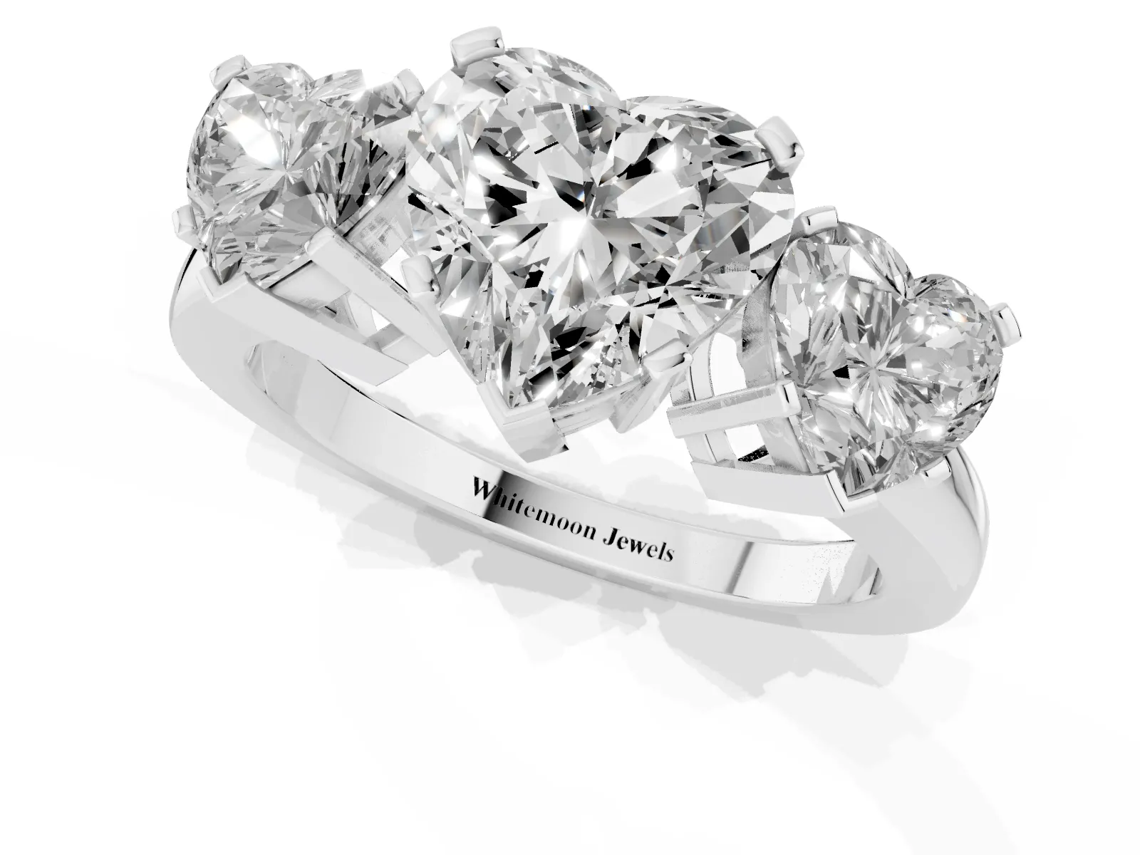 Three-Stone Heart Cut Cut Diamond Ring with Channel Set Band and Four-Prong Setting Platinum