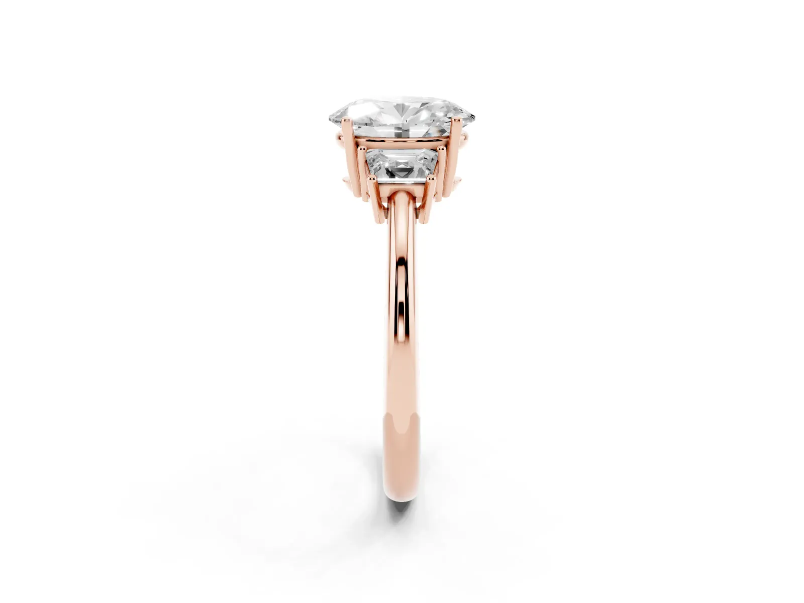 Oval Cut Diamond Three-Stone Ring with Trapezoid Side Stones and Prong Setting Rose gold